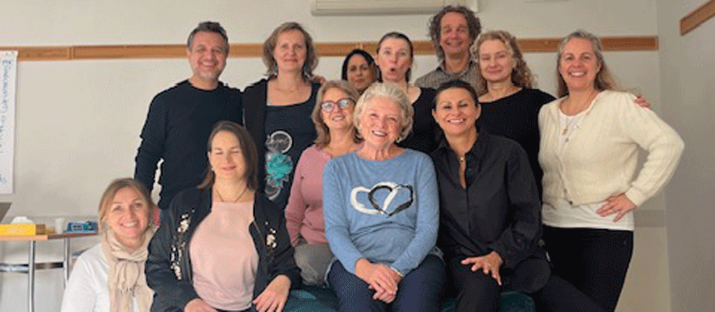 groups of students with smiling Liz Carl in the center